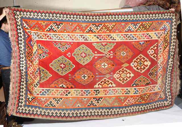 Appraisal: A RED GROUND TURKISH KELIM RUG with diamond design to