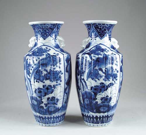 Appraisal: PAIR OF ORIENTAL BLUE AND WHITE VASES Decorated with birds