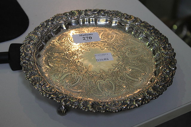 Appraisal: A SILVER SALVER of circular form with engraved decoration and