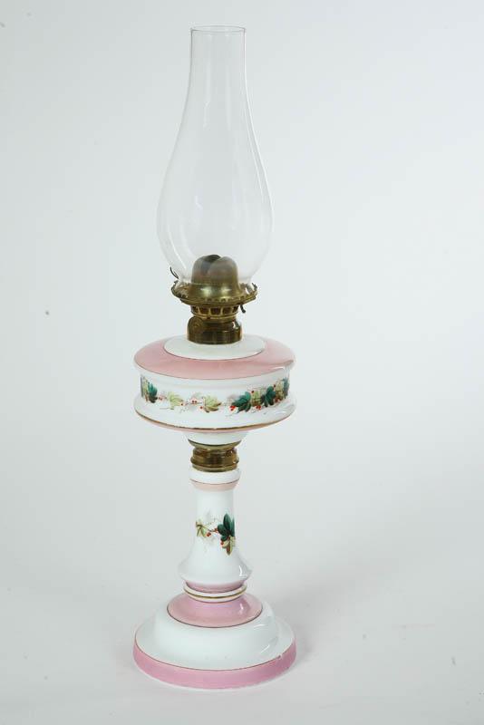 Appraisal: KEROSENE LAMP Milk glass with a circular bass baluster stem