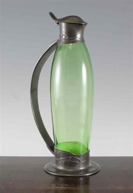 Appraisal: A Liberty Tudric pewter claret jug designed by Archibald Knox