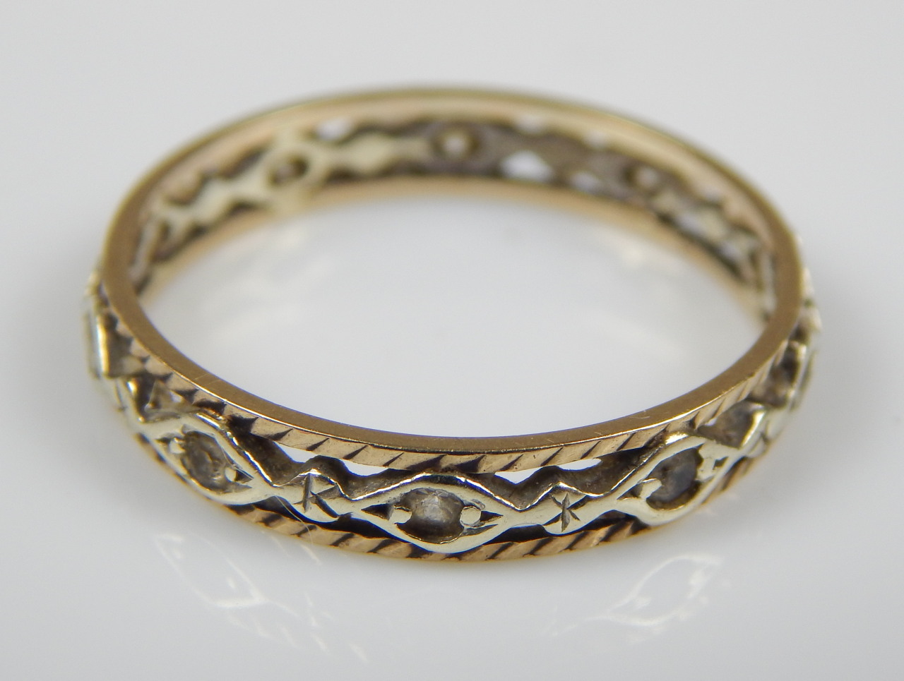 Appraisal: A ct gold dress ring of pierced design with white