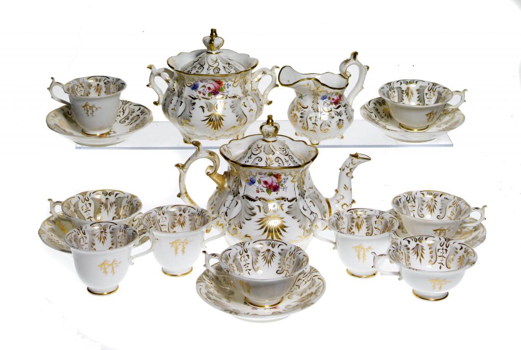 Appraisal: A ROCKINGHAM TEA AND COFFEE SERVICE of 'three-spur handle' shape