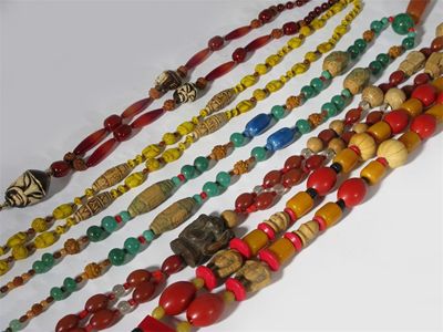 Appraisal: Five long Ebena plastic necklaces each with Oriental Galalith beads