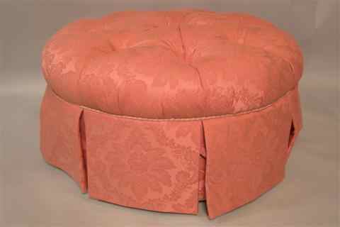 Appraisal: TUFTED PINK UPHOLSTERED CIRCULAR OTTOMAN in floral cotton damask decorated