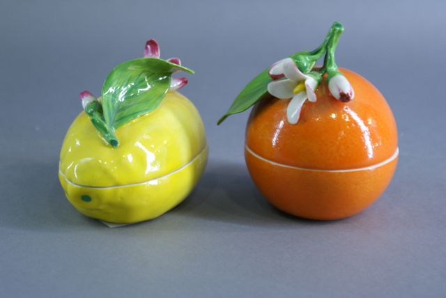 Appraisal: Two porcelain boxes Realistically moulded in the form of fruit