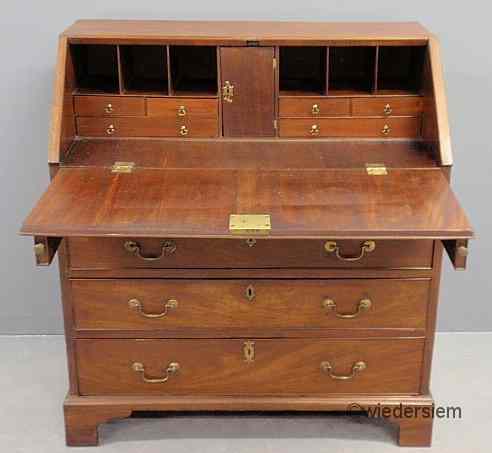 Appraisal: Georgian mahogany slant-lid desk with a pigeonholed and document drawered