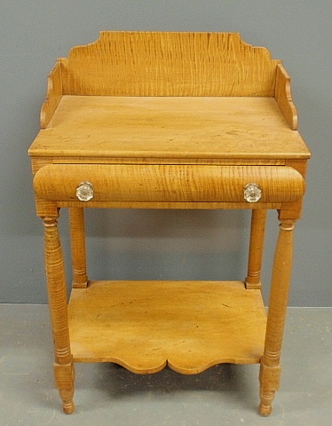 Appraisal: - Sheraton tiger maple washstand c with a shaped backsplash