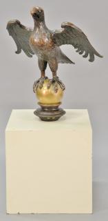 Appraisal: Large bronze eagle with wings spread perched on sphere set