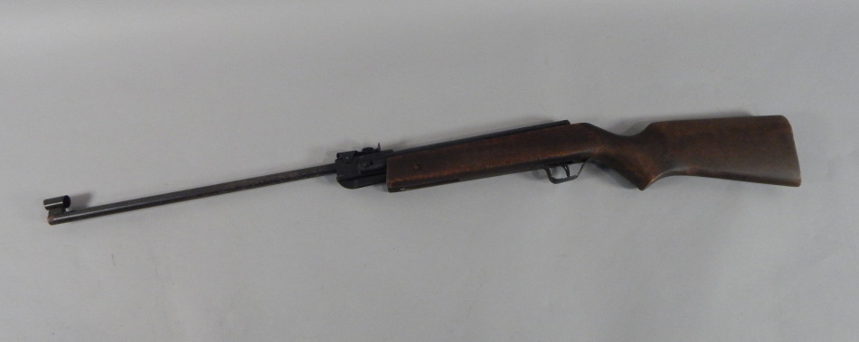 Appraisal: An air rifle with a stained beech stock stamped Made