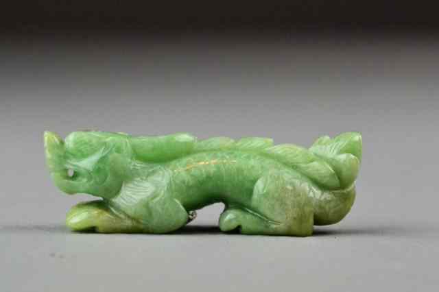 Appraisal: Chinese Carved Jade DragonFinely carved to depict a recumbant dragon