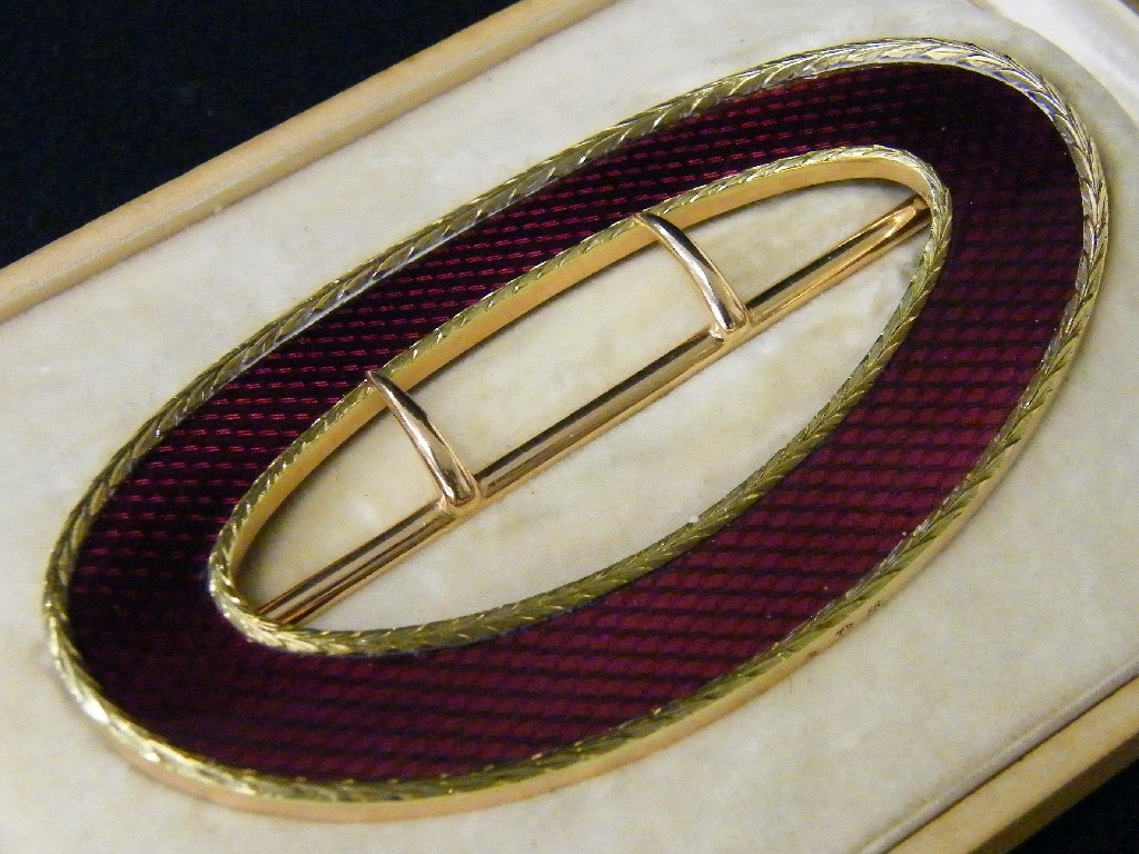 Appraisal: Faberge gold silver and ruby guilloche enamel oval belt buckle