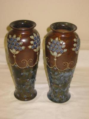 Appraisal: A PAIR OF ROYAL DOULTON STONEWARE VASES of baluster form