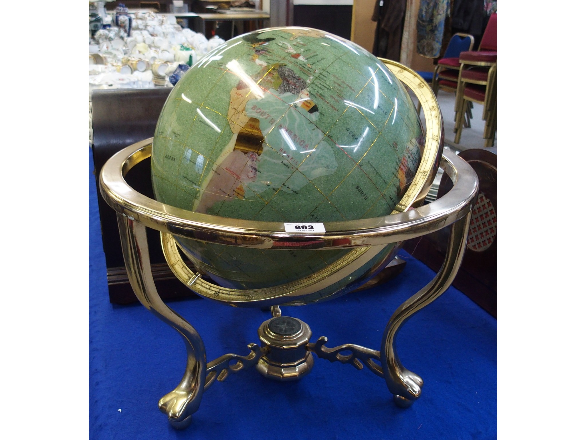 Appraisal: A multi-gemstone set globe of the world