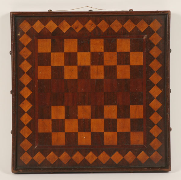 Appraisal: Folk art game board with decorated back mahogany and secondary