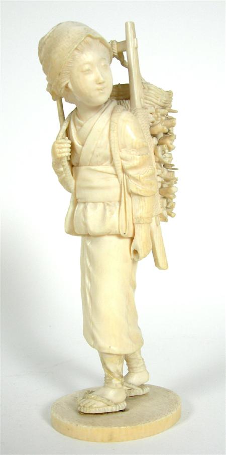 Appraisal: JAPANESE IVORY OKIMONO TH CENTURY modelled as a young girl