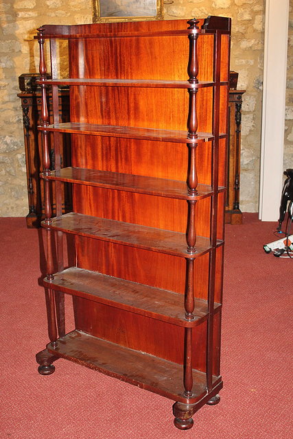 Appraisal: A VICTORIAN OPEN FRONTED MAHOGANY BOOKCASE with three quarter gallery