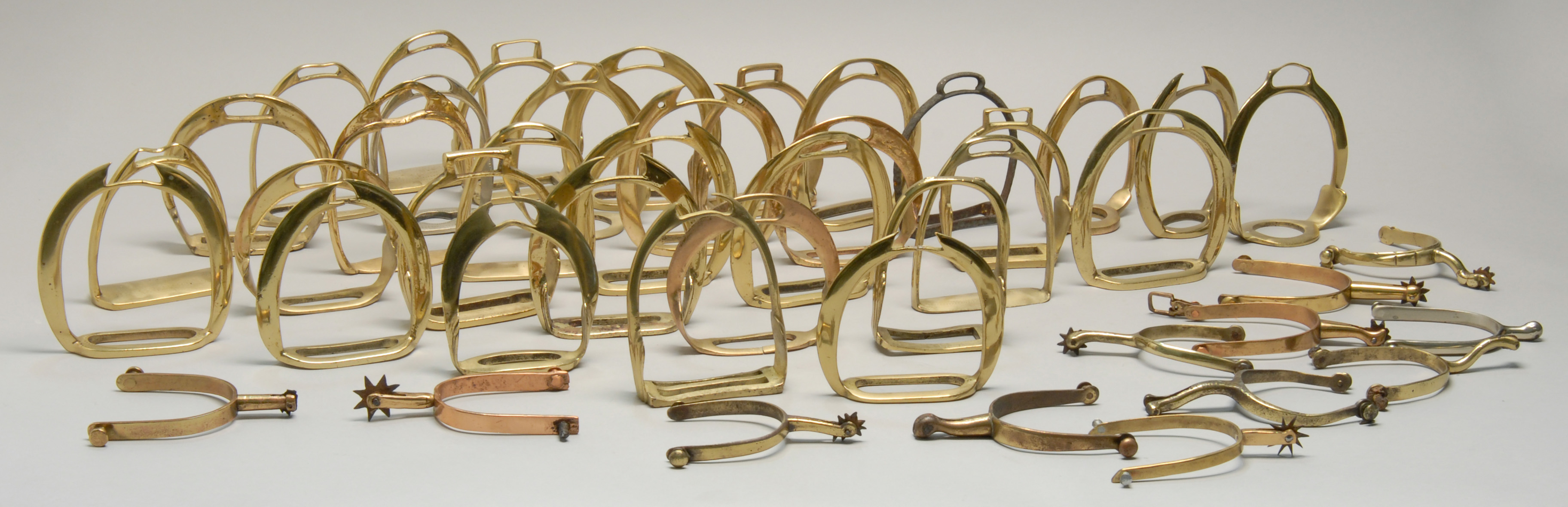 Appraisal: LARGE COLLECTION OF STIRRUPS AND SPURS Includes thirty-one matched pairs