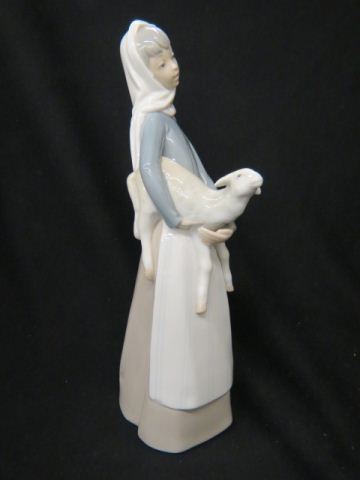 Appraisal: Lladro Porcelain Figurine of Girl holding a Lamb excellent