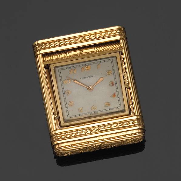 Appraisal: An k gold travel watch with sprung cover retailed by