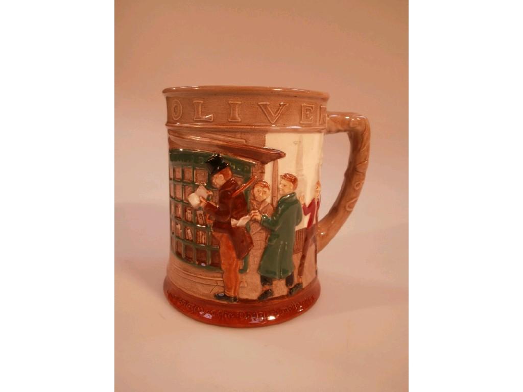 Appraisal: A Royal Doulton 'Oliver Twist' relief moulded mug cm high