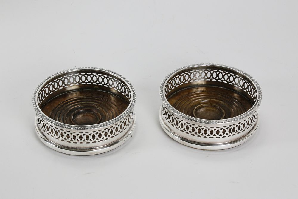 Appraisal: Two Sheffield Silver Plated Wine Coasters th Century Two Sheffield