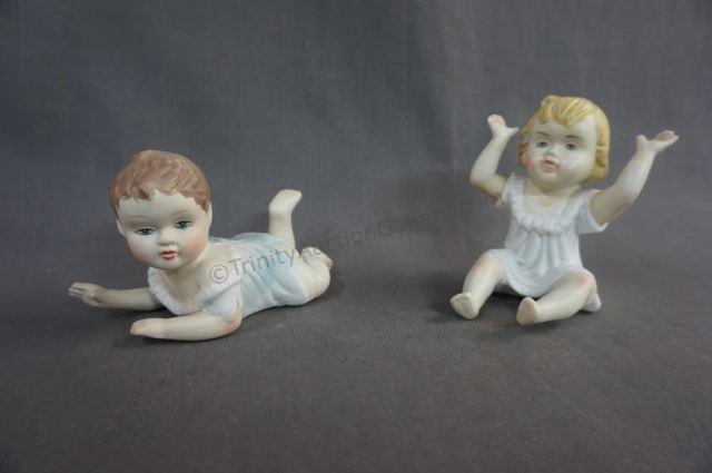 Appraisal: German Bisque Boy and Girl Piano Baby Figurines - German