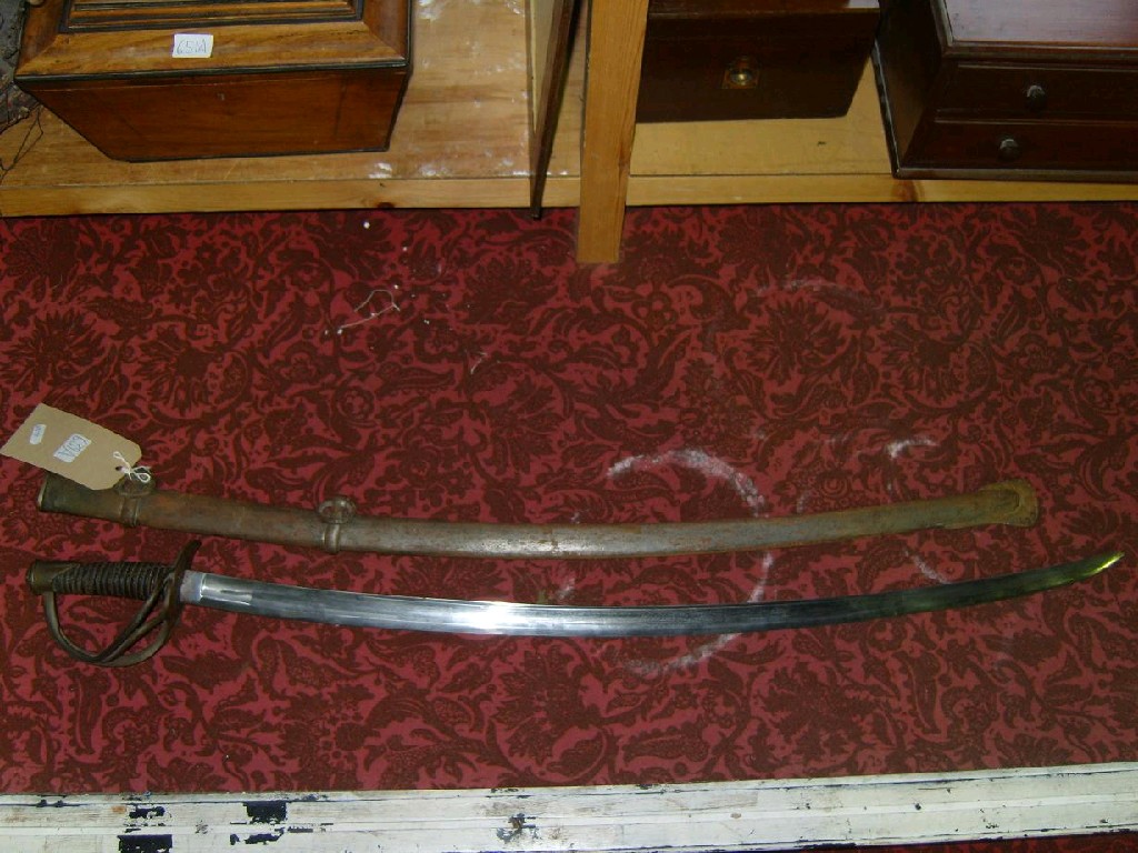 Appraisal: A mid- th century British Cavalry Officer's sword and scabbard