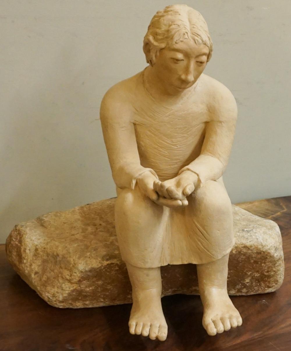 Appraisal: CERAMIC FIGURE OF SEATED MAN ON ROCK H OVERALL IN