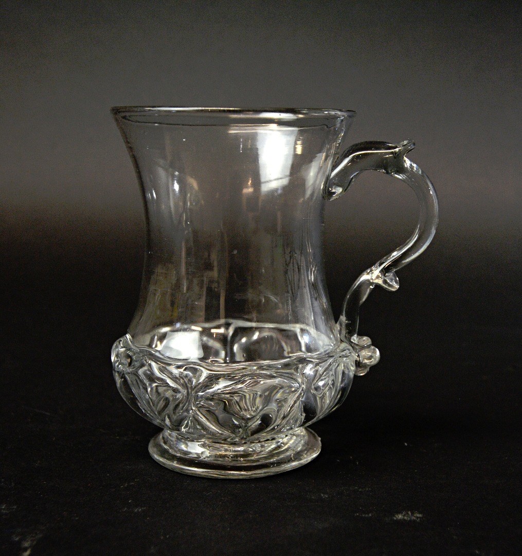 Appraisal: An English glass mug circa with pinched waist body and