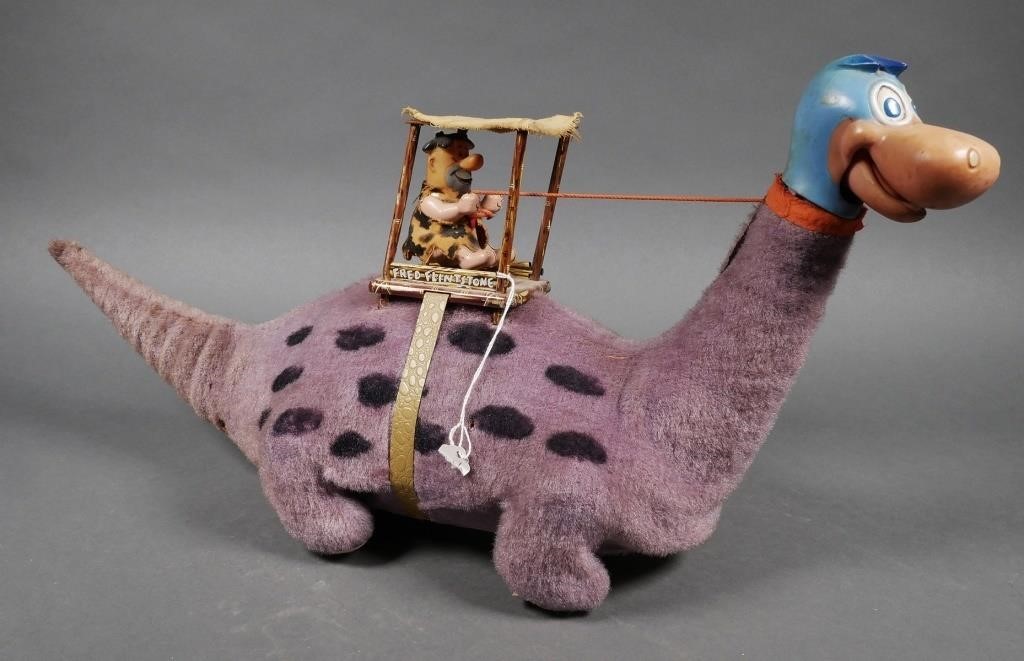 Appraisal: Vintage battery operated Marx Fred Flintstone driving a brontosaurus toy