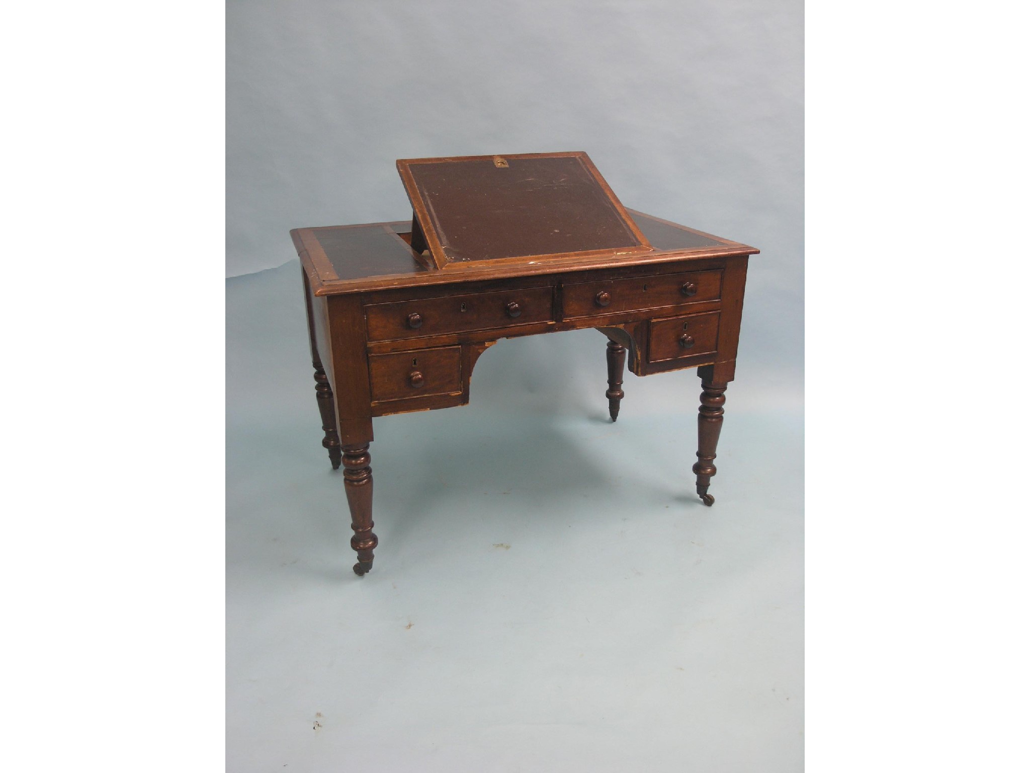 Appraisal: A Victorian mahogany desk inset vinyl top with adjustable slope