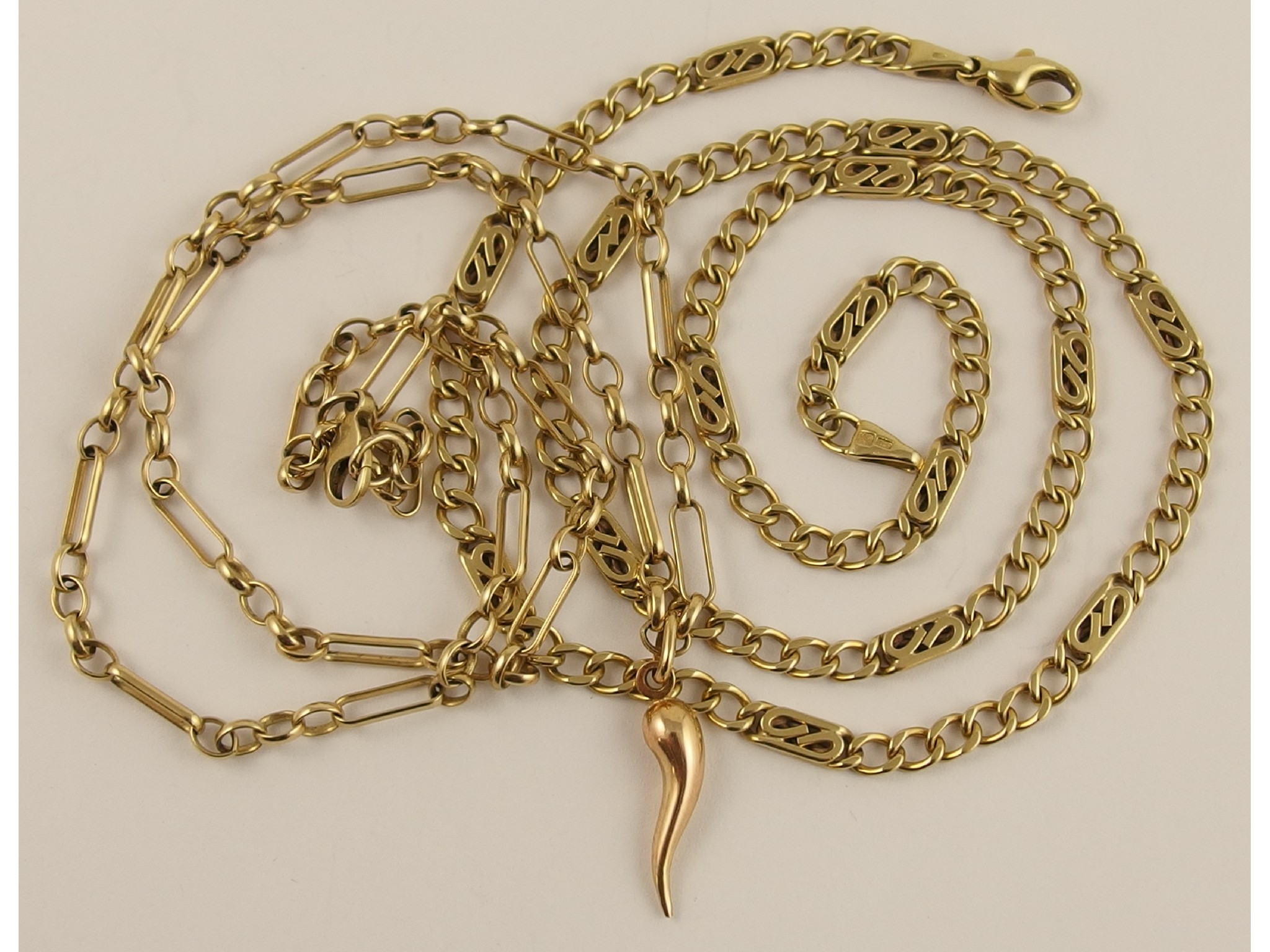 Appraisal: Two ct decorative chains and a ct horn of plenty