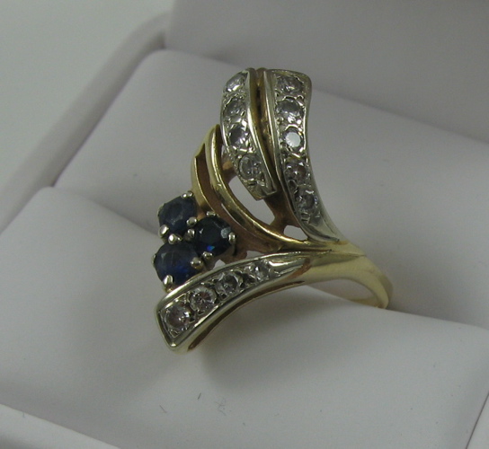 Appraisal: SAPPHIRE DIAMOND AND FOURTEEN KARAT GOLD RING set with three