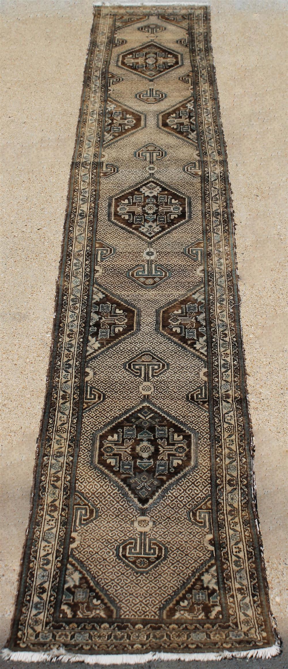 Appraisal: LONG UNUSUAL ORIENTAL TRIBAL DESIGN MEDALLION WITH DROPS WOOL RUNNER