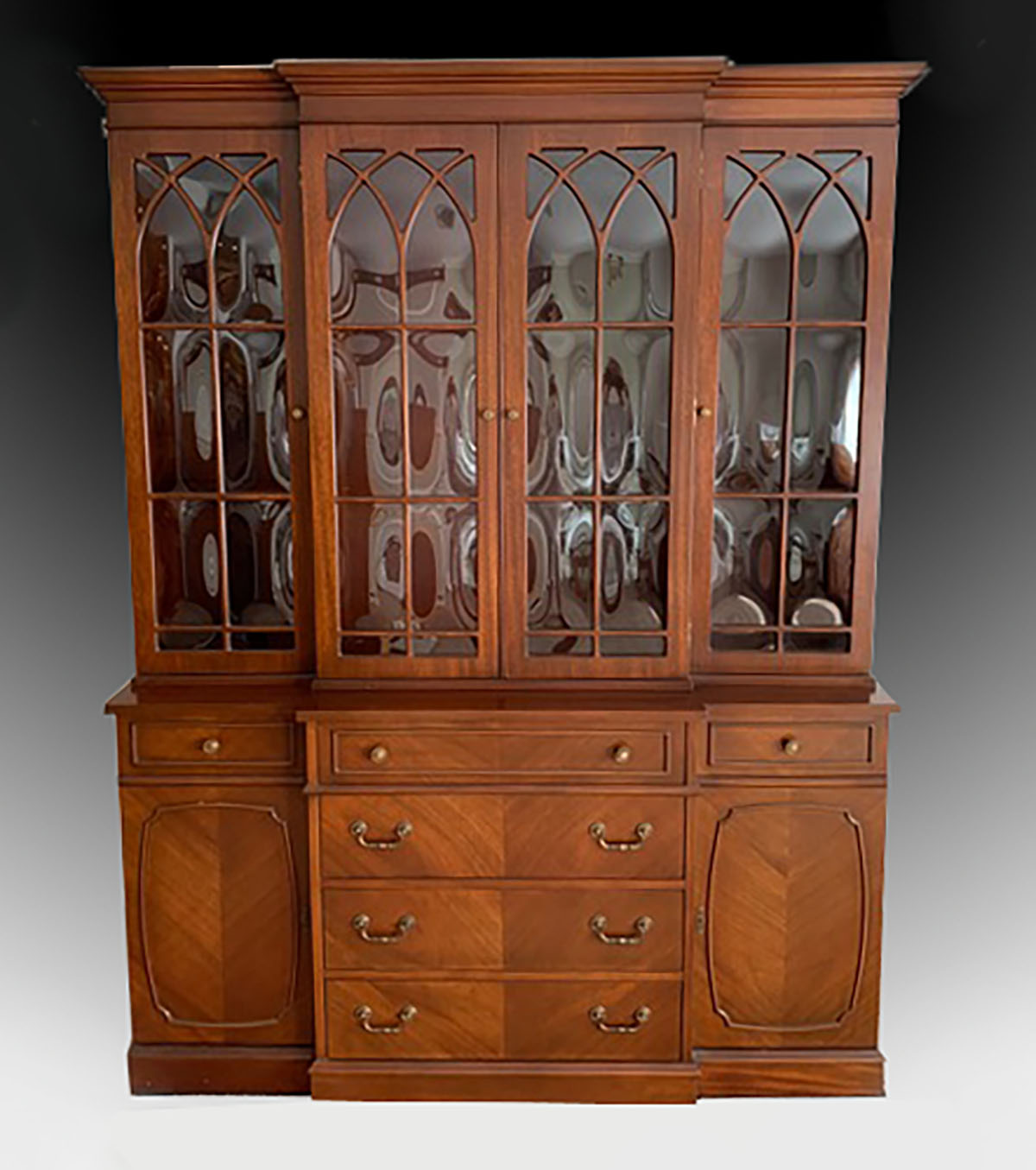 Appraisal: A FORMAL MAHOGANY BREAKFRONT BUBBLE GLASS SECRETARY A most interesting