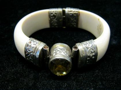 Appraisal: Ivory and citrine bangle braceletLarge oval cut citrine set in