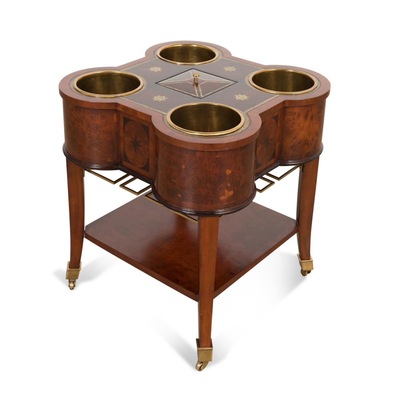 Appraisal: MAITLAND SMITH BOTTLE WINE COOLER TABLE Maitland Smith mahogany and