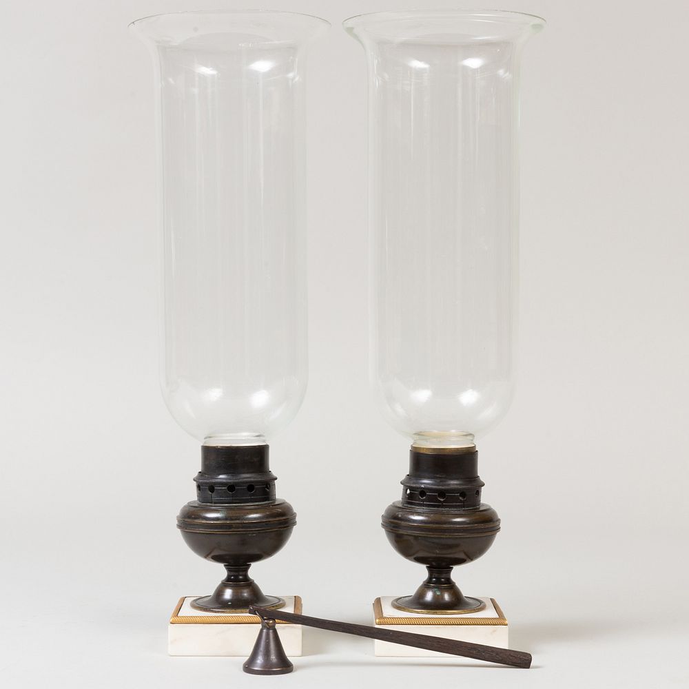 Appraisal: Pair of Glass Photophores with Bronze Bases The bronze bases