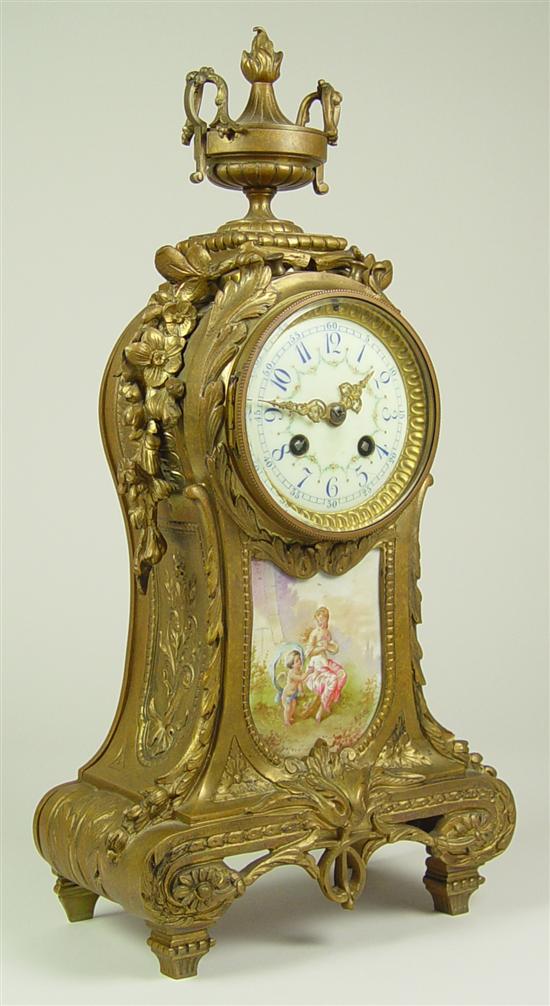 Appraisal: French Gilt Brass Porcelain Clock Porcelain dial with scalloped floral