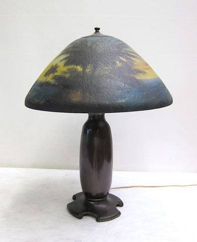 Appraisal: MOE-BRIDGES TABLE LAMP American c s featuring a reverse-painted cracked