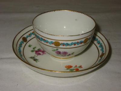 Appraisal: A CHELSEA PORCELAIN TEA BOWL AND SAUCER painted with scattered