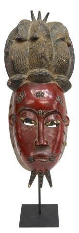 Appraisal: African figural carved mask likely Baule people Ivory Coast red