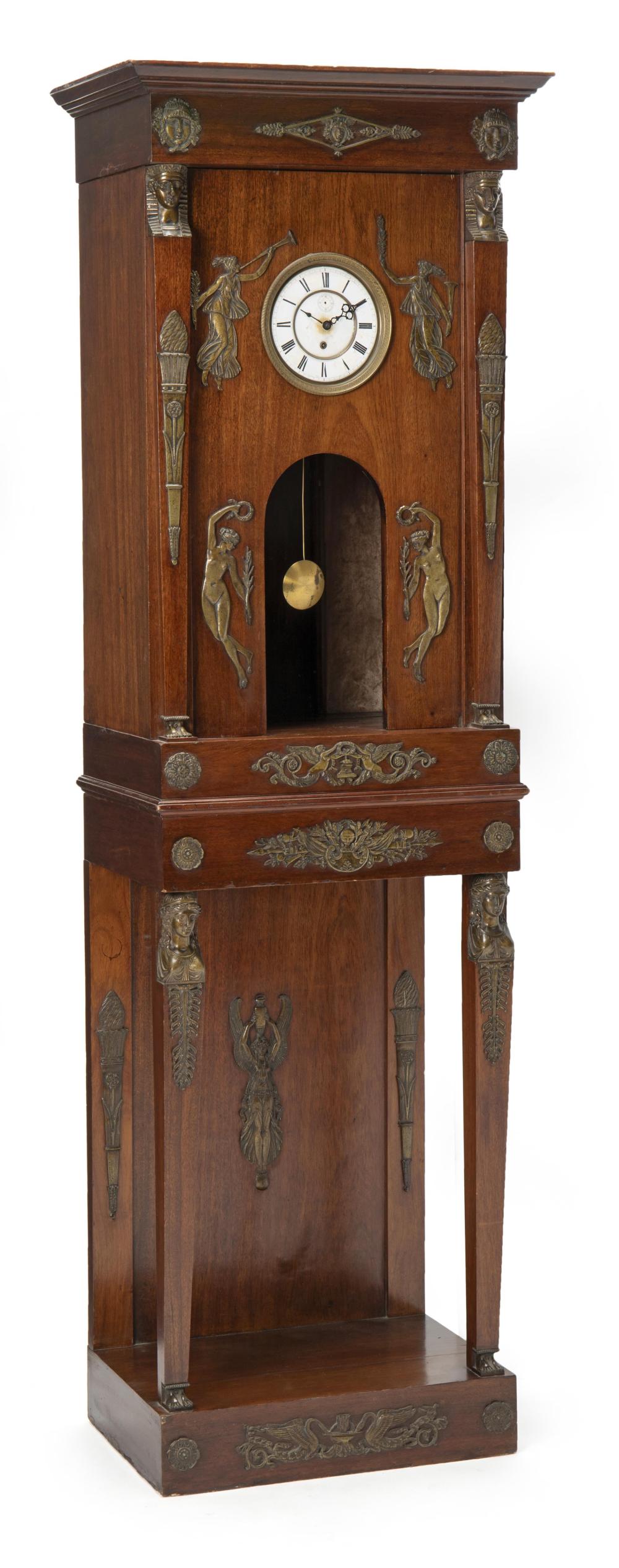 Appraisal: An Empire mahogany cabinet with clock th Century Centering a