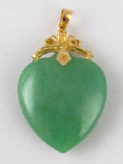 Appraisal: A jade heart pendant with yellow metal tests carat gold