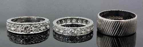 Appraisal: A modern platinum mounted diamond eternity ring the face set