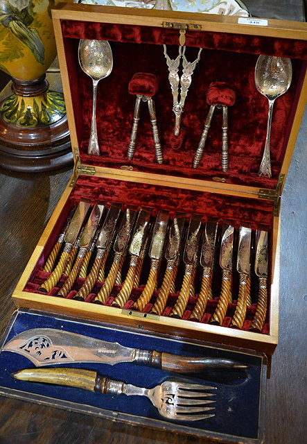 Appraisal: A cased set of bone handled tea knives and forkstogether