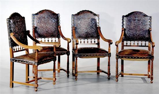 Appraisal: Four Continental carved walnut and embossed leather armchairs mid th