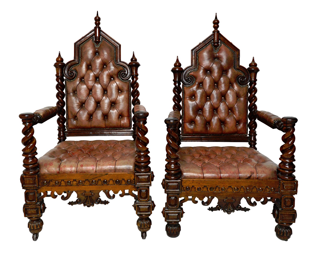 Appraisal: A pair of Victorian Gothic Revival rosewood framed leather upholstered