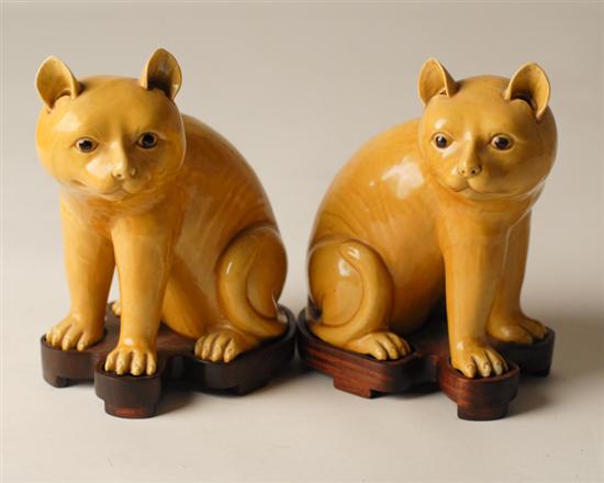 Appraisal: A Pair of Chinese Porcelain Figural Cats glazed Imperial yellow